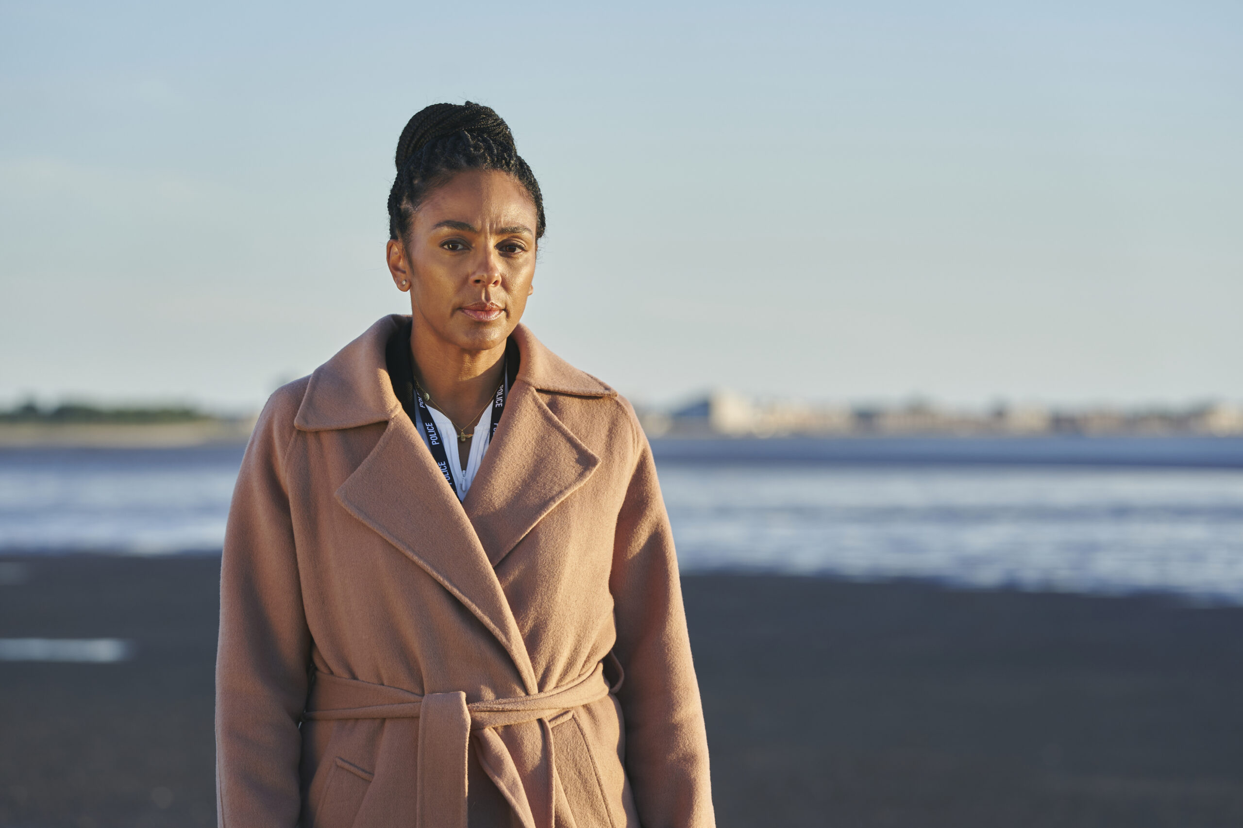 Jenn Townsend frowns on the beach in The Bay