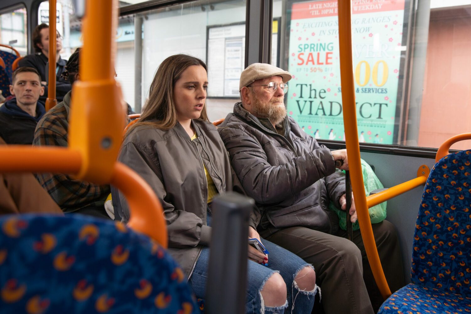 Coronation Street's Amy is looking uncomfortable whilst sitting next to an old man on the bus