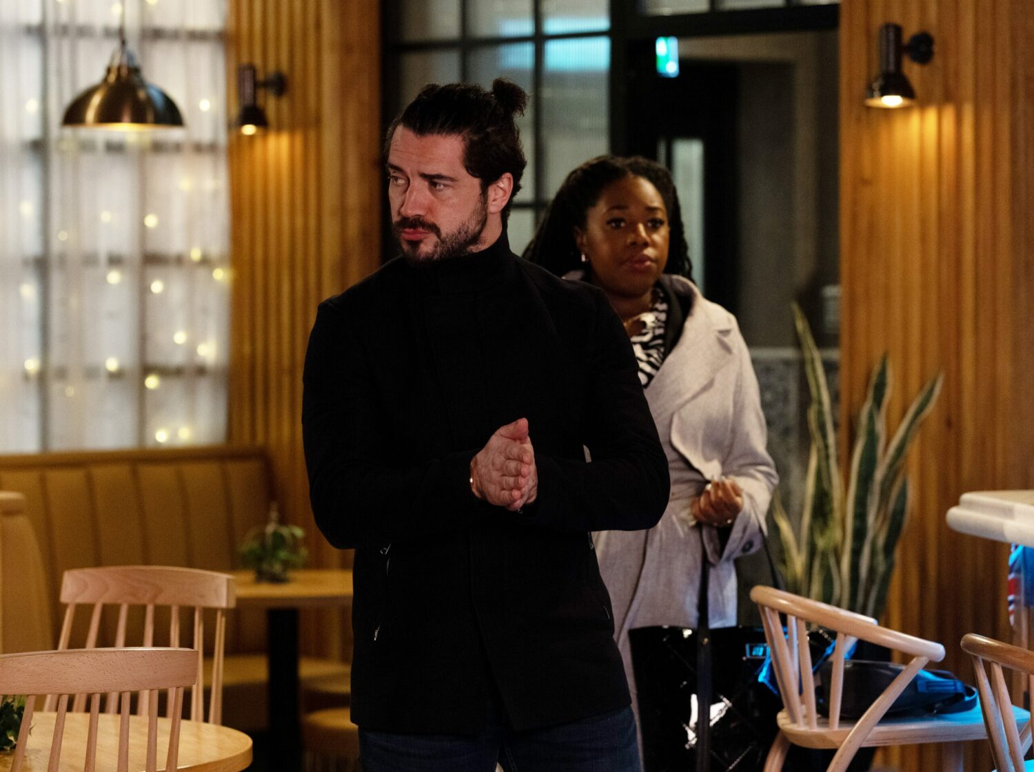 Adam Barlow and Dee-Dee Bailey look around the bistro suspiciously