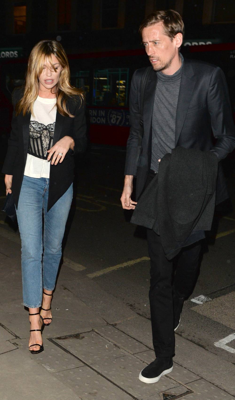 Abbey Clancy and Peter Crouch walk together