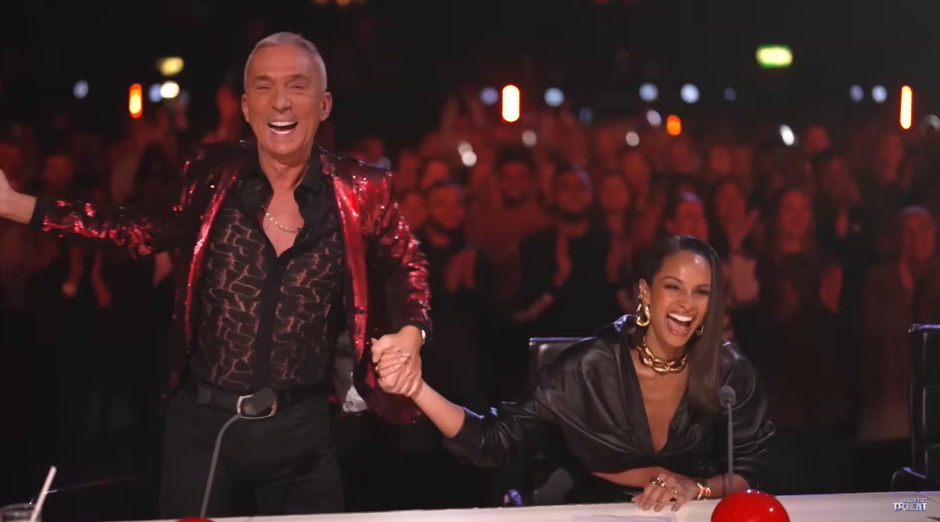 Bruno Tonioli and Alesha Dixon laugh as he stands up and throws his arms out on Britain's Got Talent