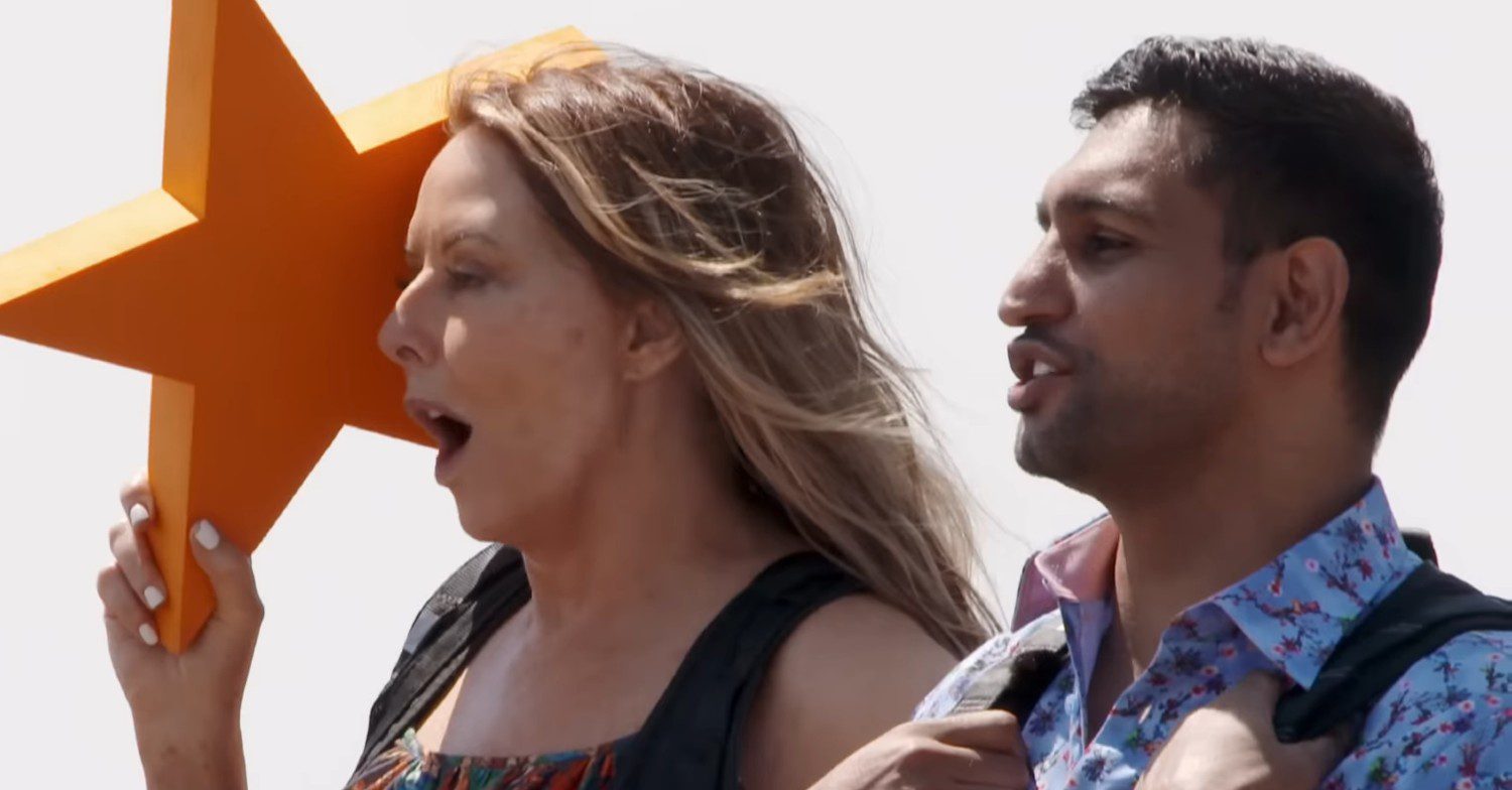 I'm A Celebrity stars Carol Vordeman, holding a star, and Amir Khan