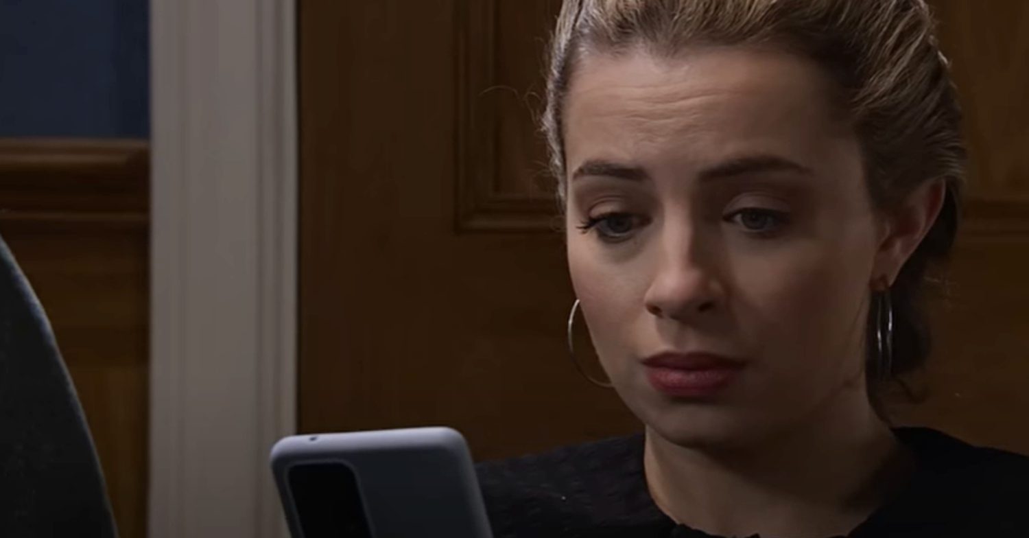 Coronation Street's Daisy is on her phone whilst looking guilty