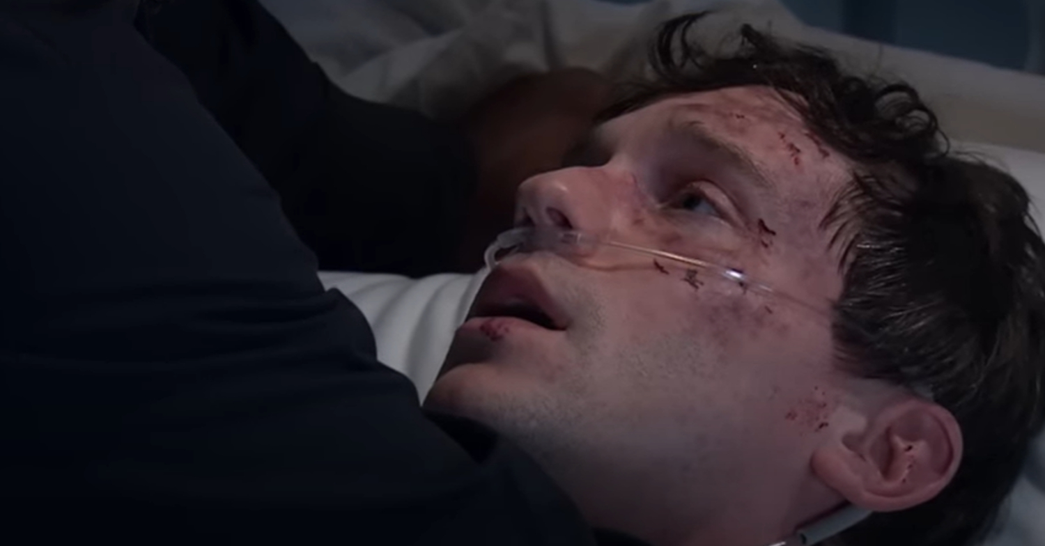 Emmerdale's Alex is being pinned down by Charles on the hospital bed