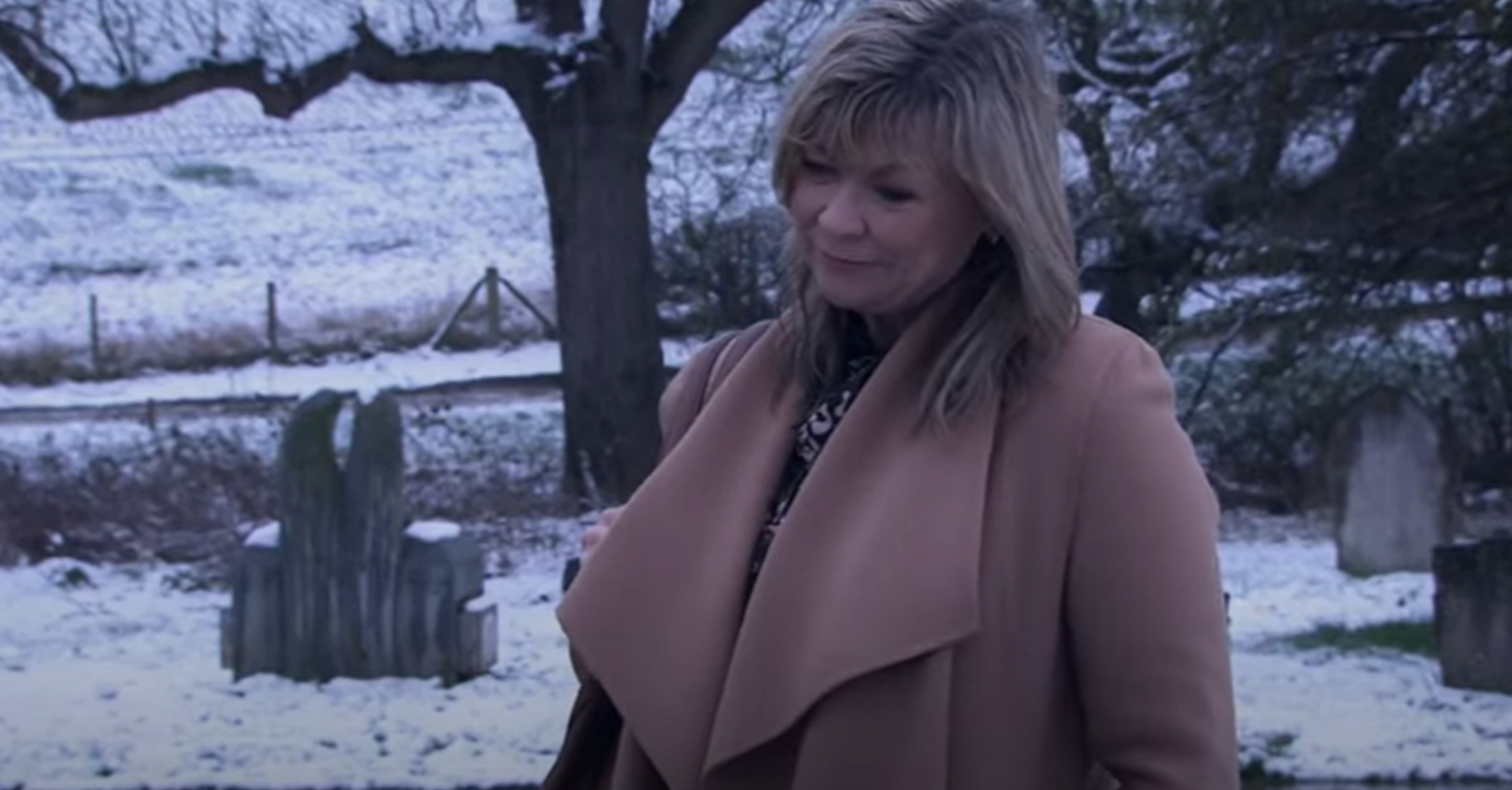 Emmerdale's Kim Tate is in the snow at the graveyard