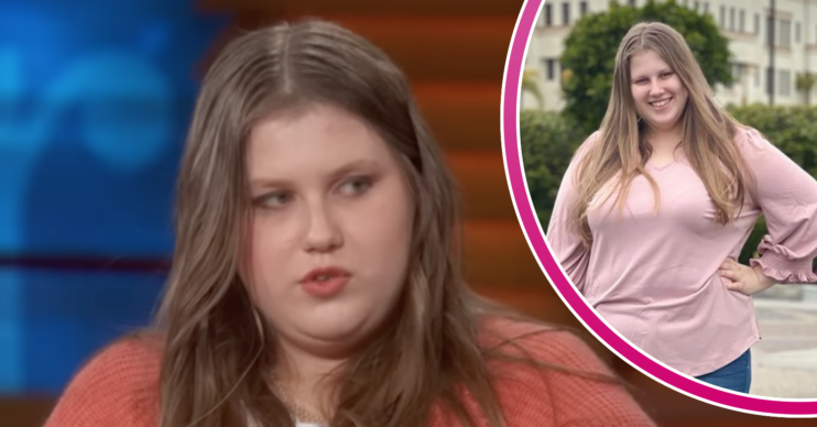 Julia Wandelt looking concerned and smiling in a pink top