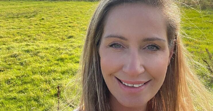 Nicola Bulley smiles with a field behind her