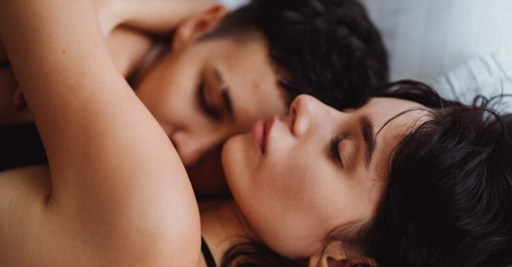 Two people embrace one another