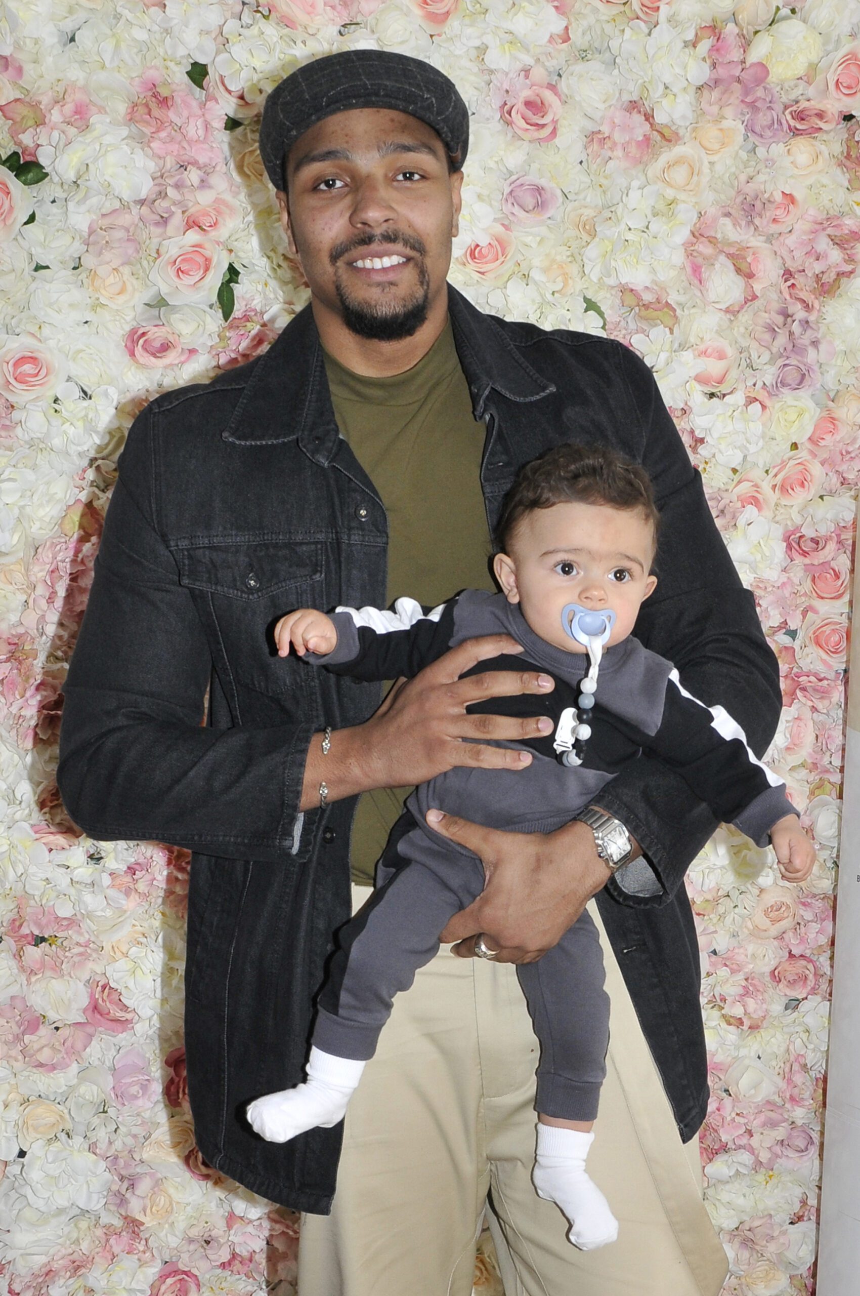 Jordan Banjo holding his son Cassius