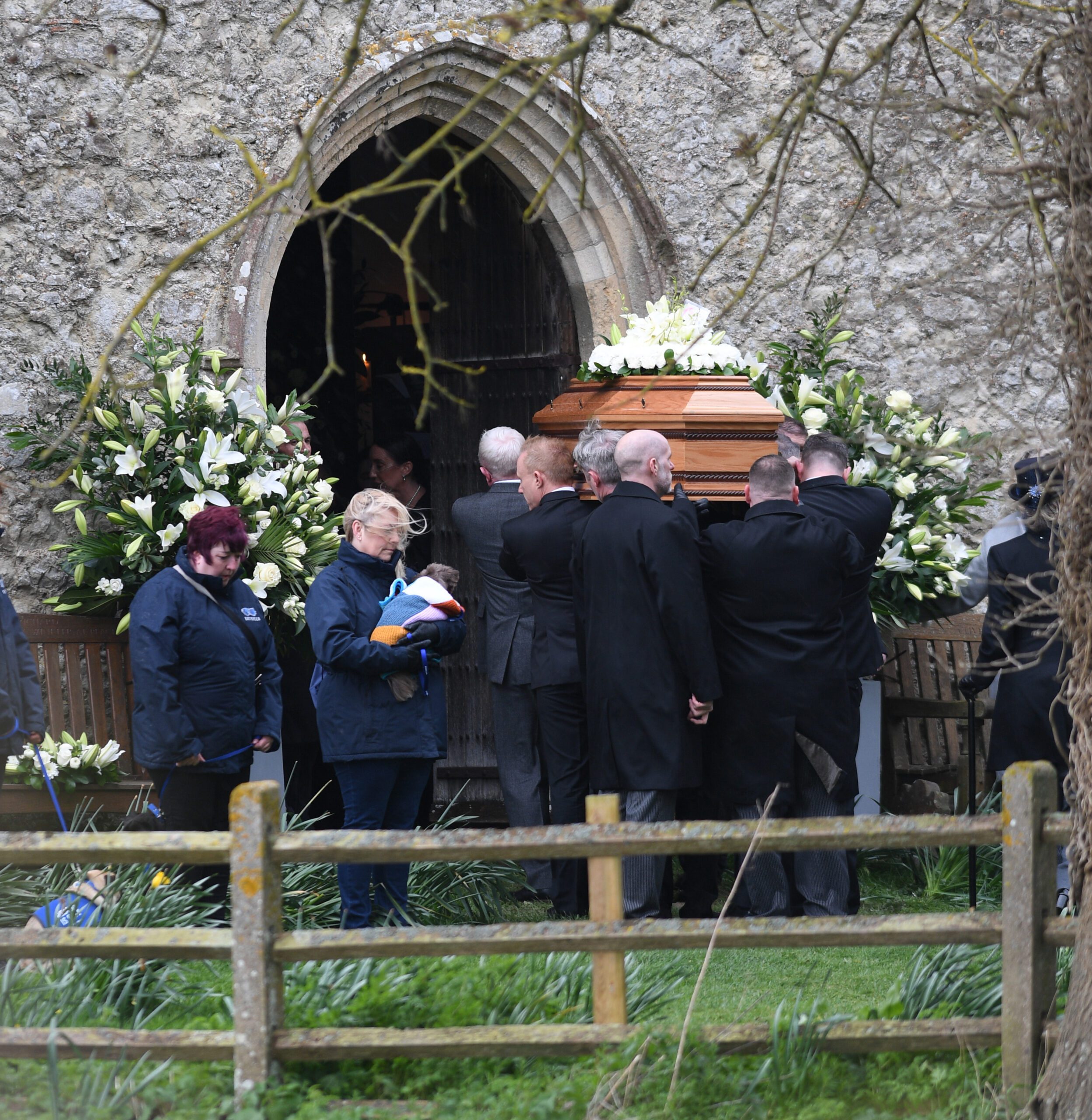 Paul O'Grady's coffin being carried into church