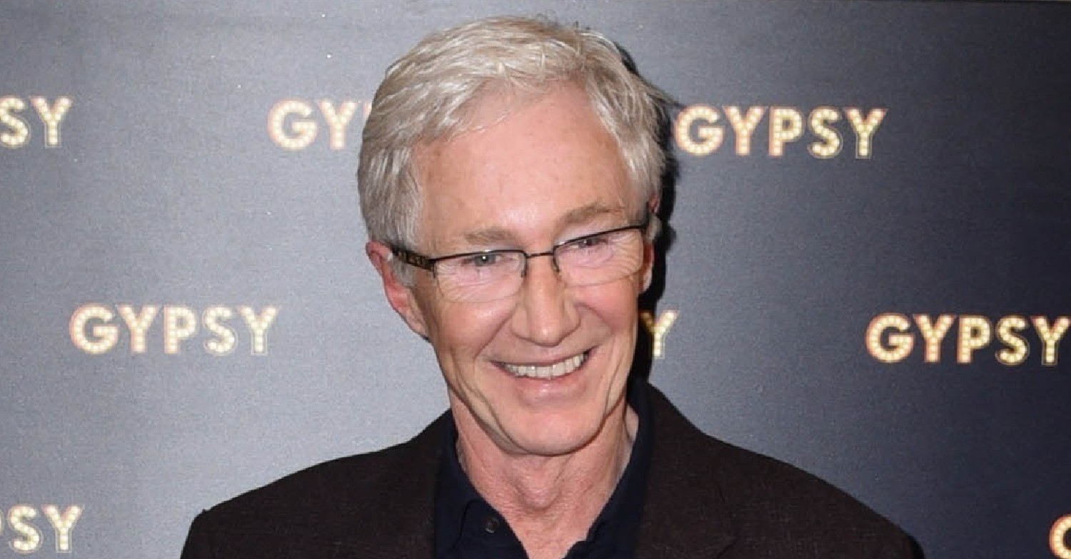 Paul O'Grady smiling at an event 