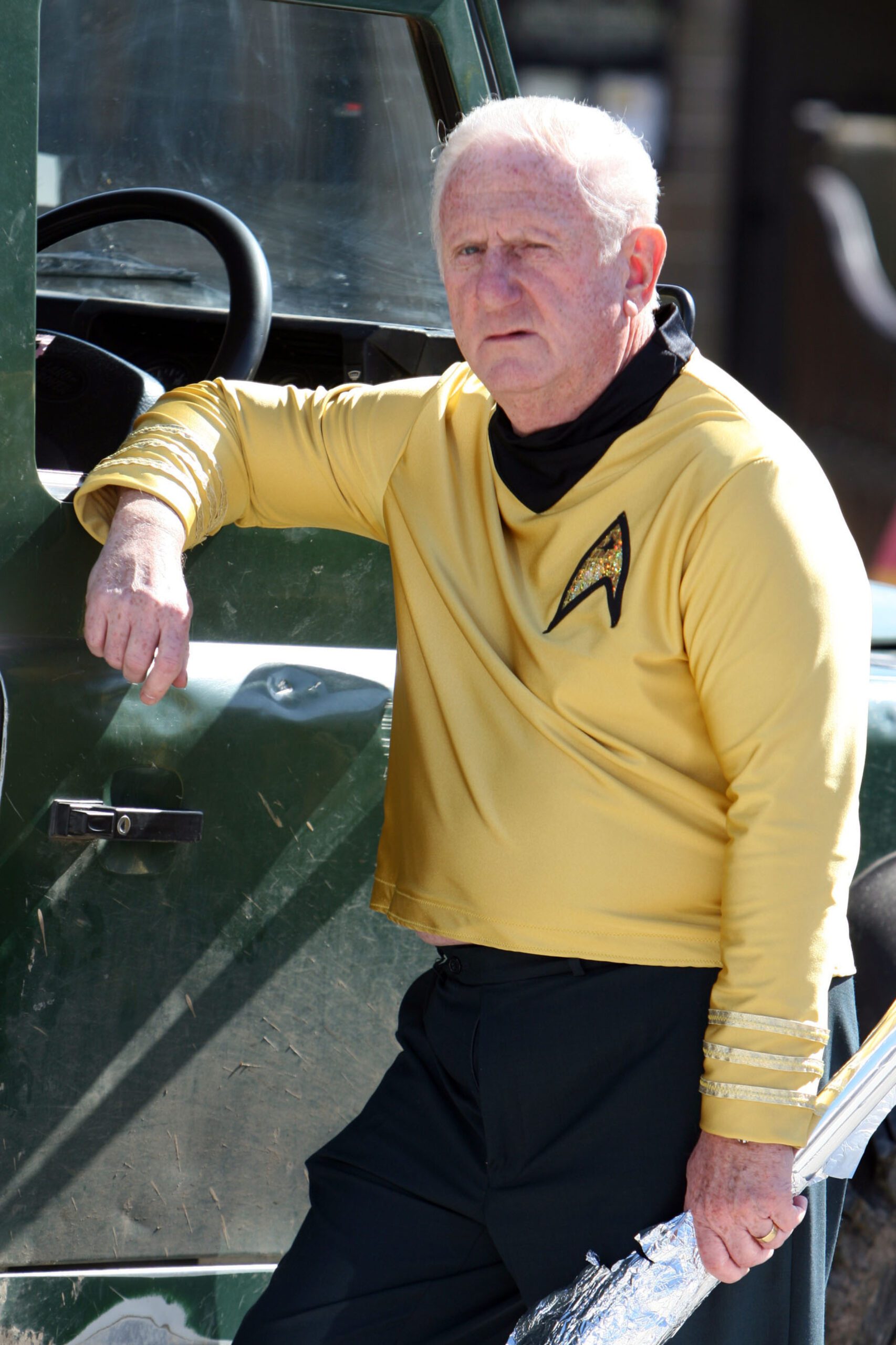 Len Reynolds in Emmerdale dressed in Star Trek gear leaning in a car window