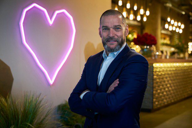 Fred Sirieix poses in First Dates restaurant
