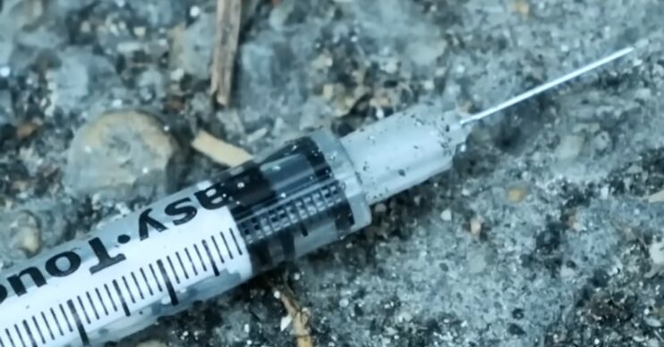 A syringe on the floor