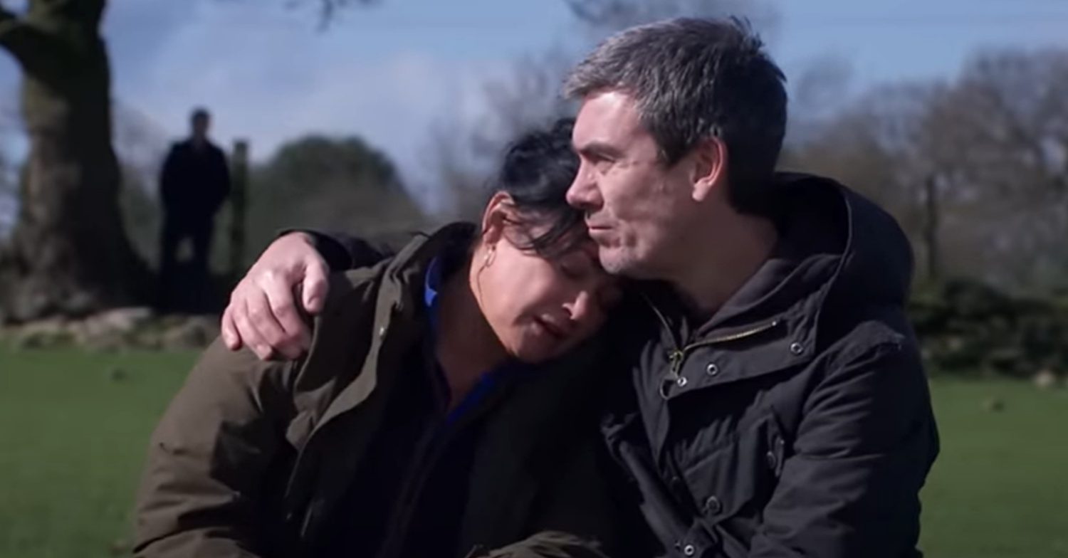 Emmerdale's Cain is comforting Moira on the field as Caleb watches them in the distance