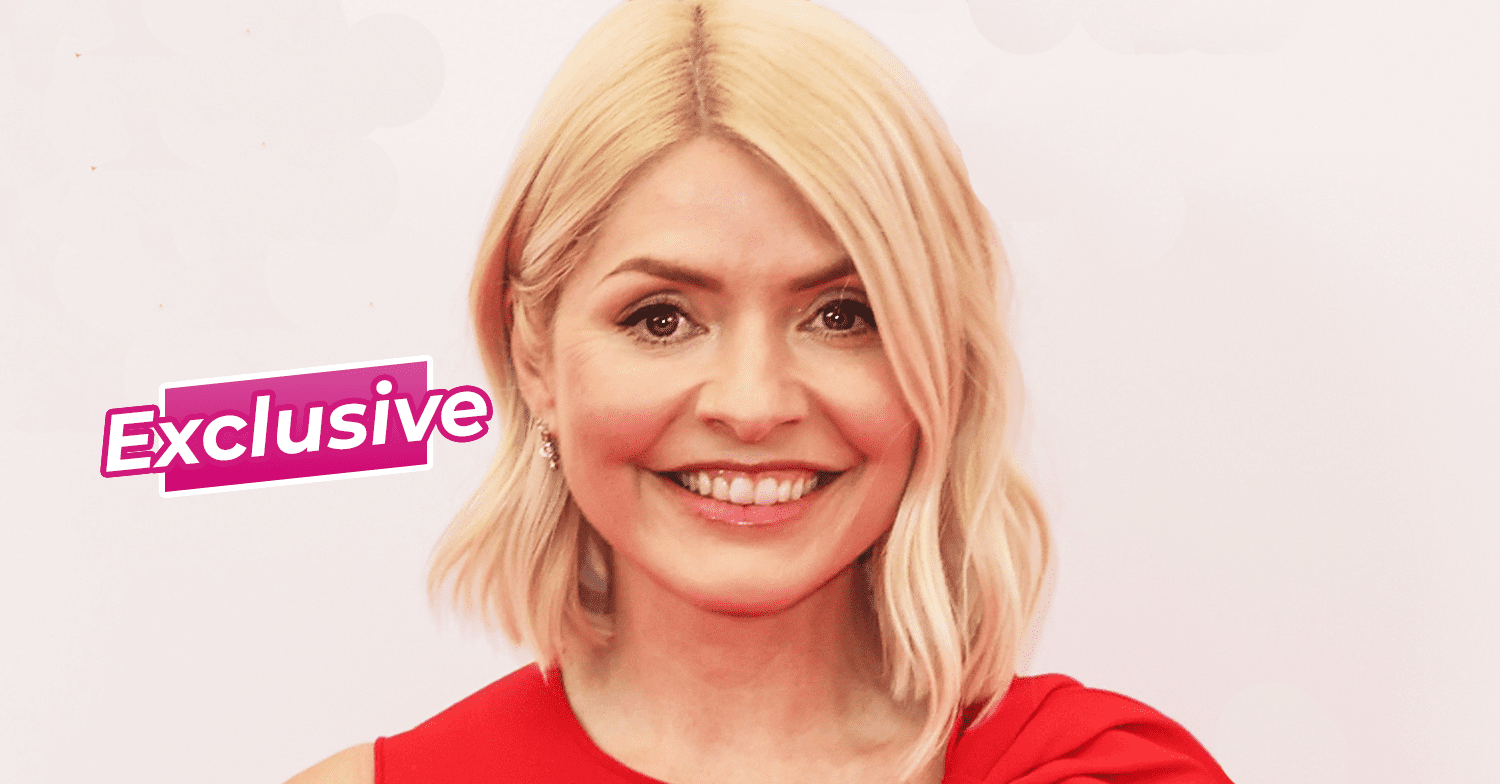 Holly Willoughby smiling in a red dress