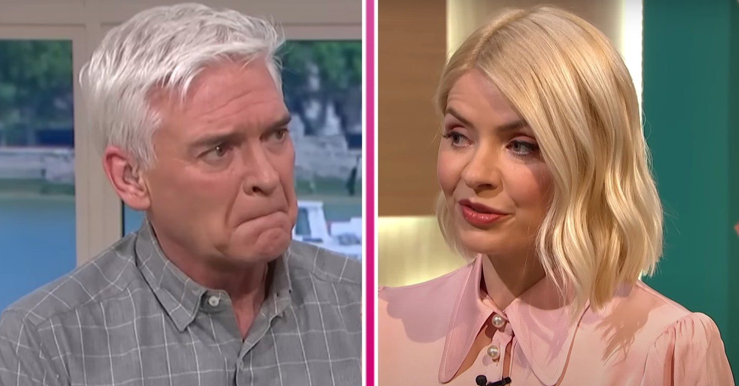 Phil looks emotional and Holly looks to her side