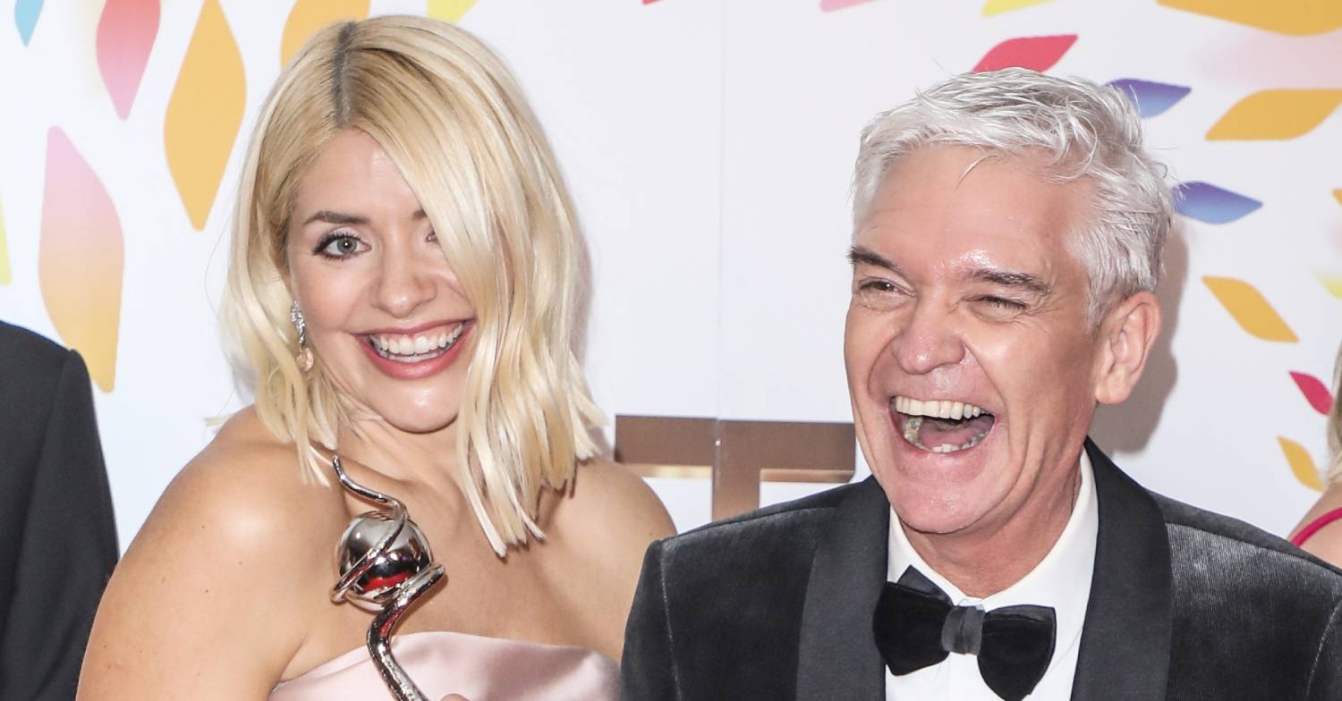 Phillip Schofield laughs with Holly Willoughby at awards