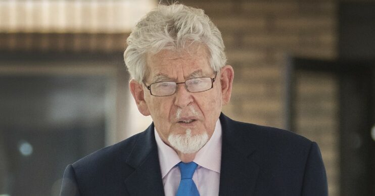 Rolf Harris looking serious in suit