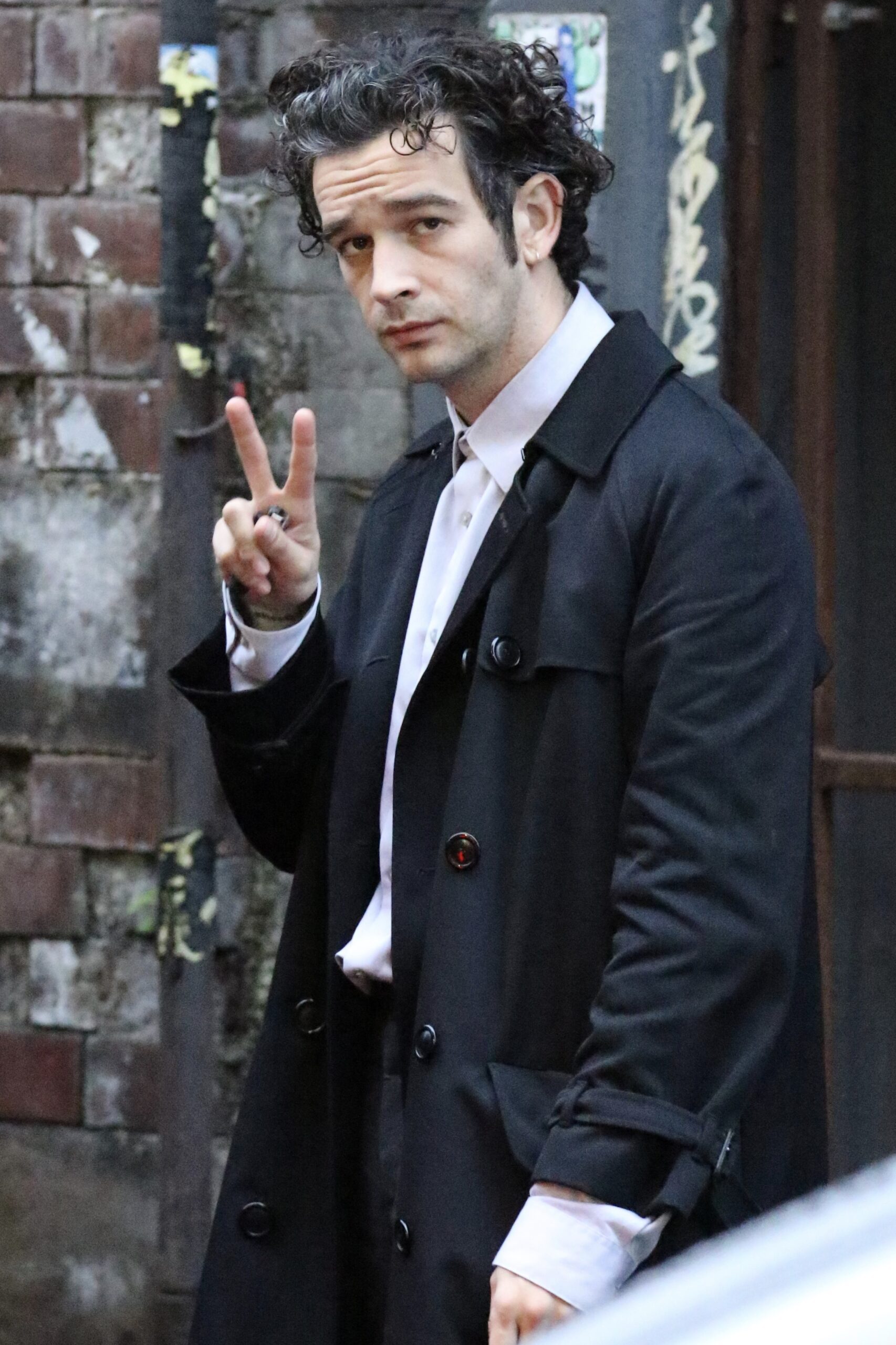 Matty Healy poses while filming in Manchester