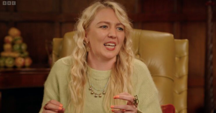 Maddy Smedley smiles on The Traitors on BBC