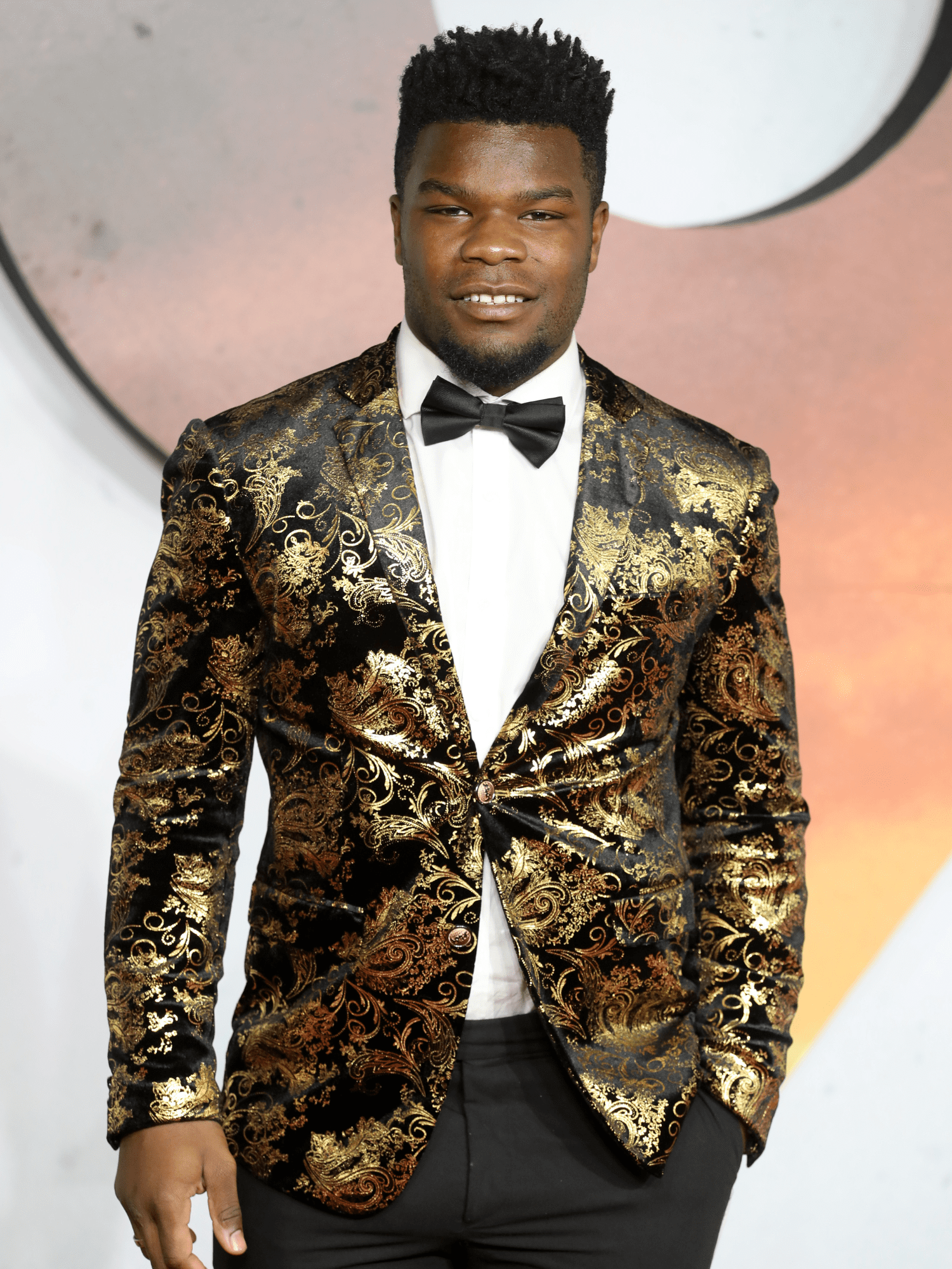 Levi Davis wearing a gold suit