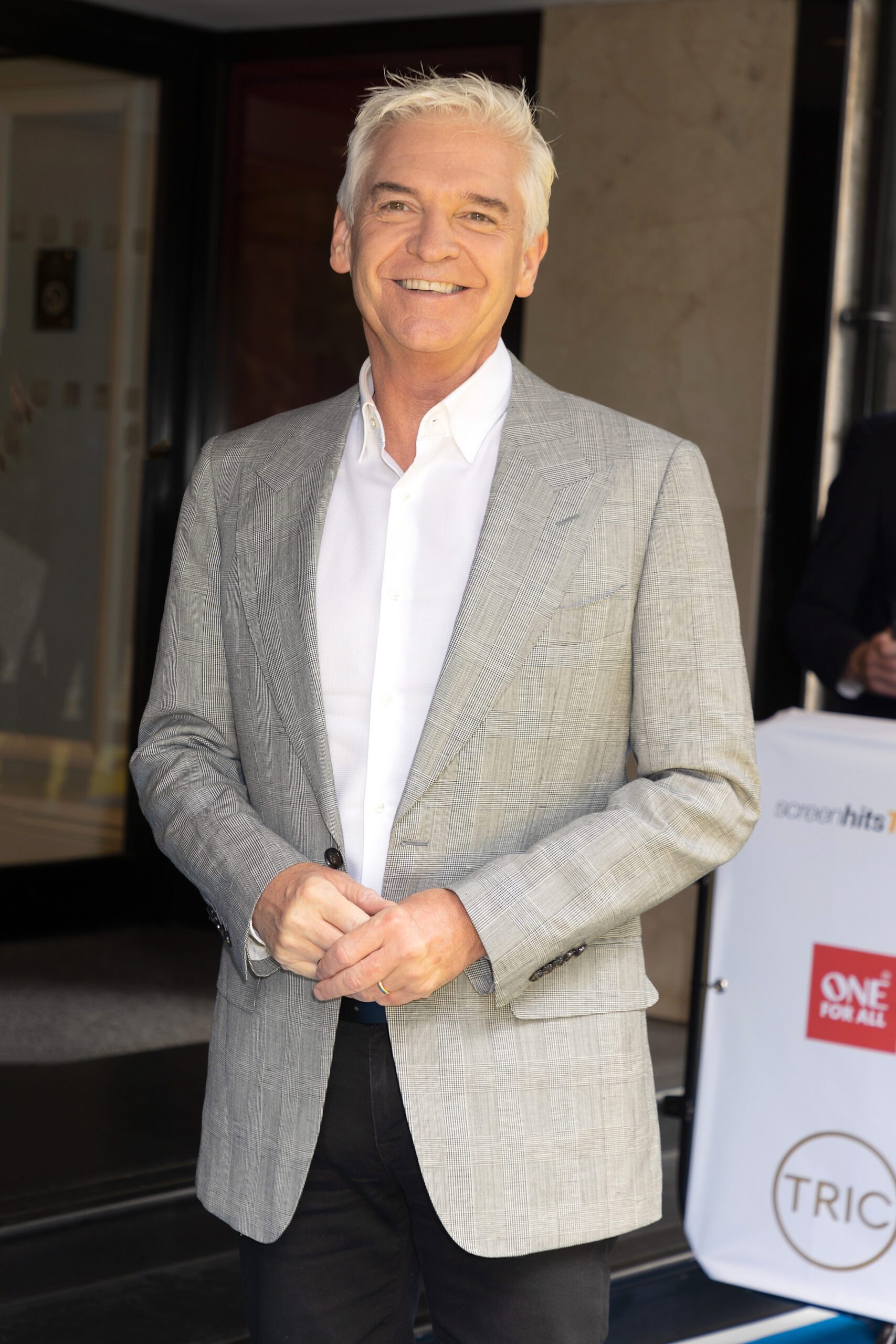 Phillip Schofield smiles at event