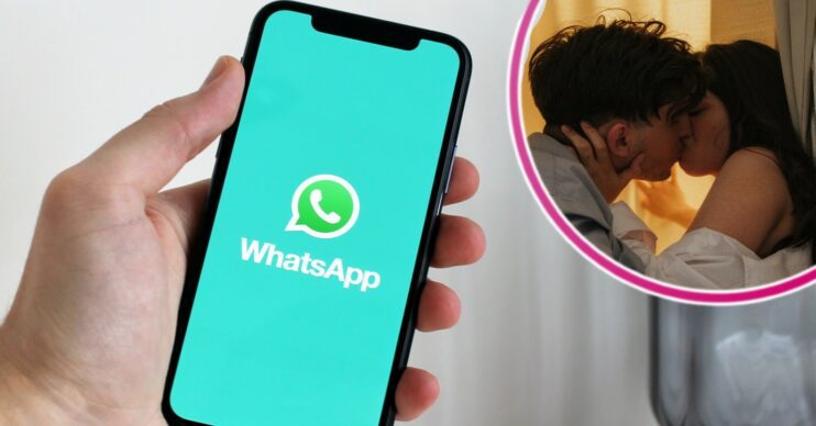 A phone with the WhatsApp logo app and two people kissing