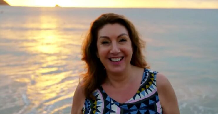 Jane McDonald smiling on a beach (Credit: Channel 5/YouTube/Composite: Entertainment Daily!)
