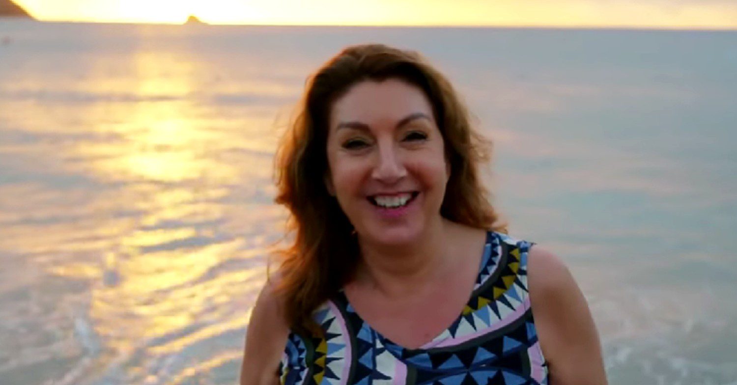 Jane McDonald smiling on a beach (Credit: Channel 5/YouTube/Composite: Entertainment Daily!)