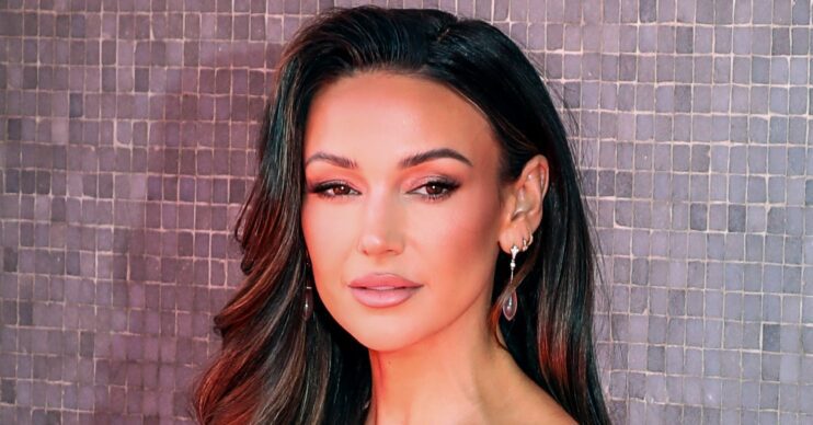 Michelle Keegan posing on a red carpet