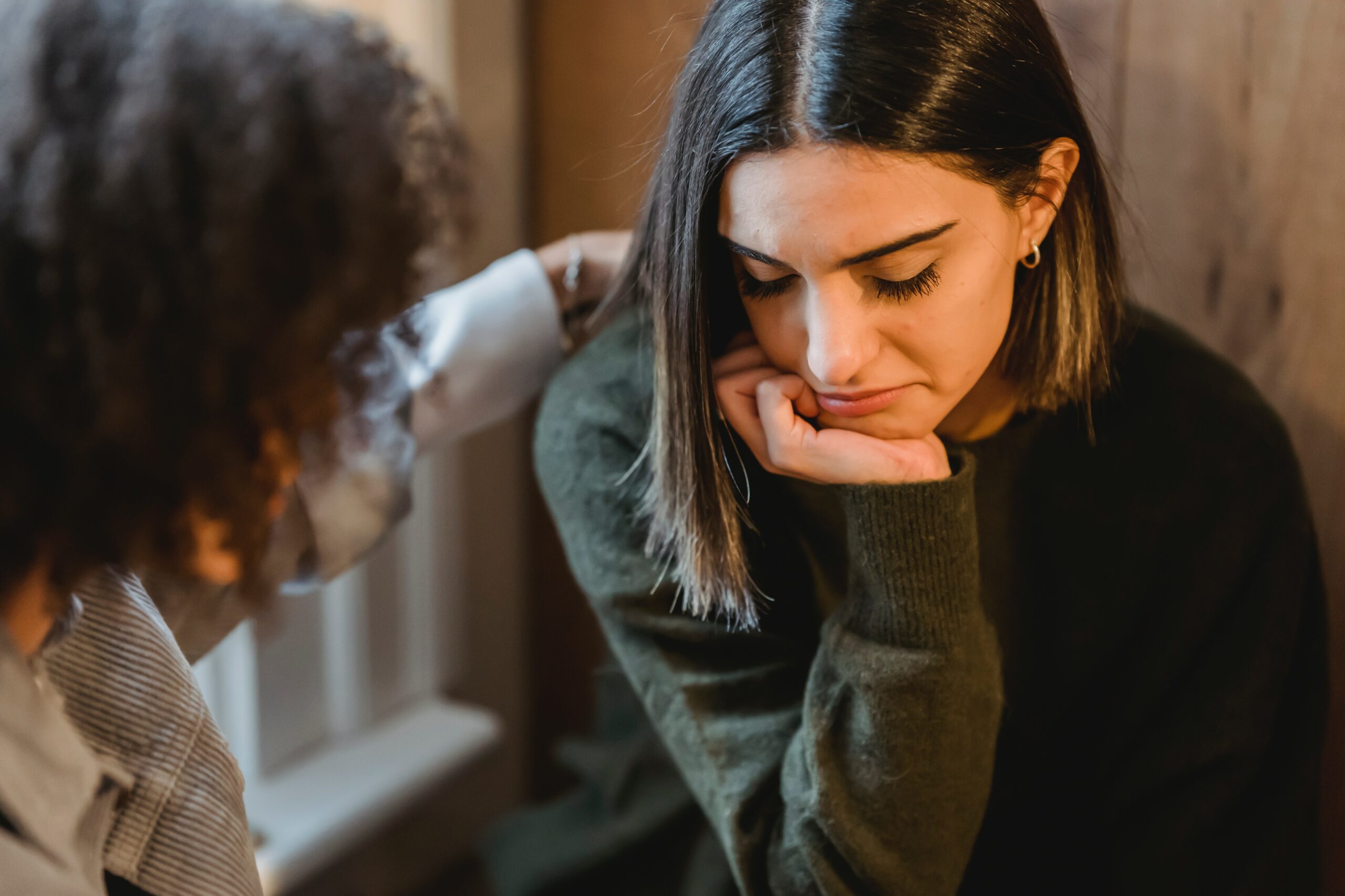 Woman frowns with friend