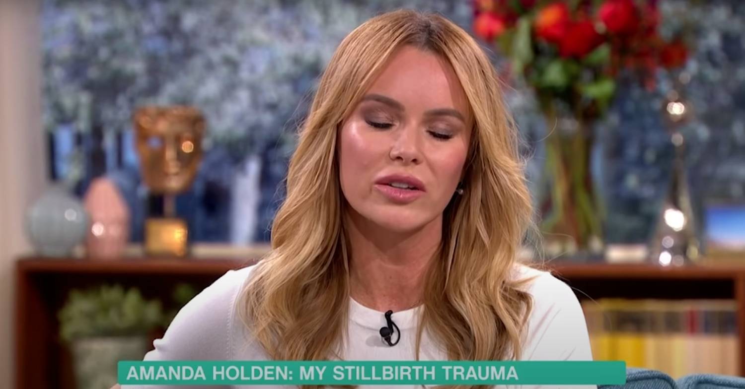 Amanda Holden closes her eyes