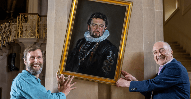 Blackadder painting being hung