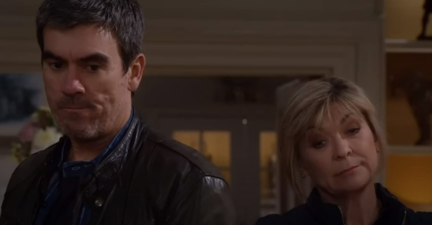 Emmerdale's Cain and Kim look furious, standing side by side