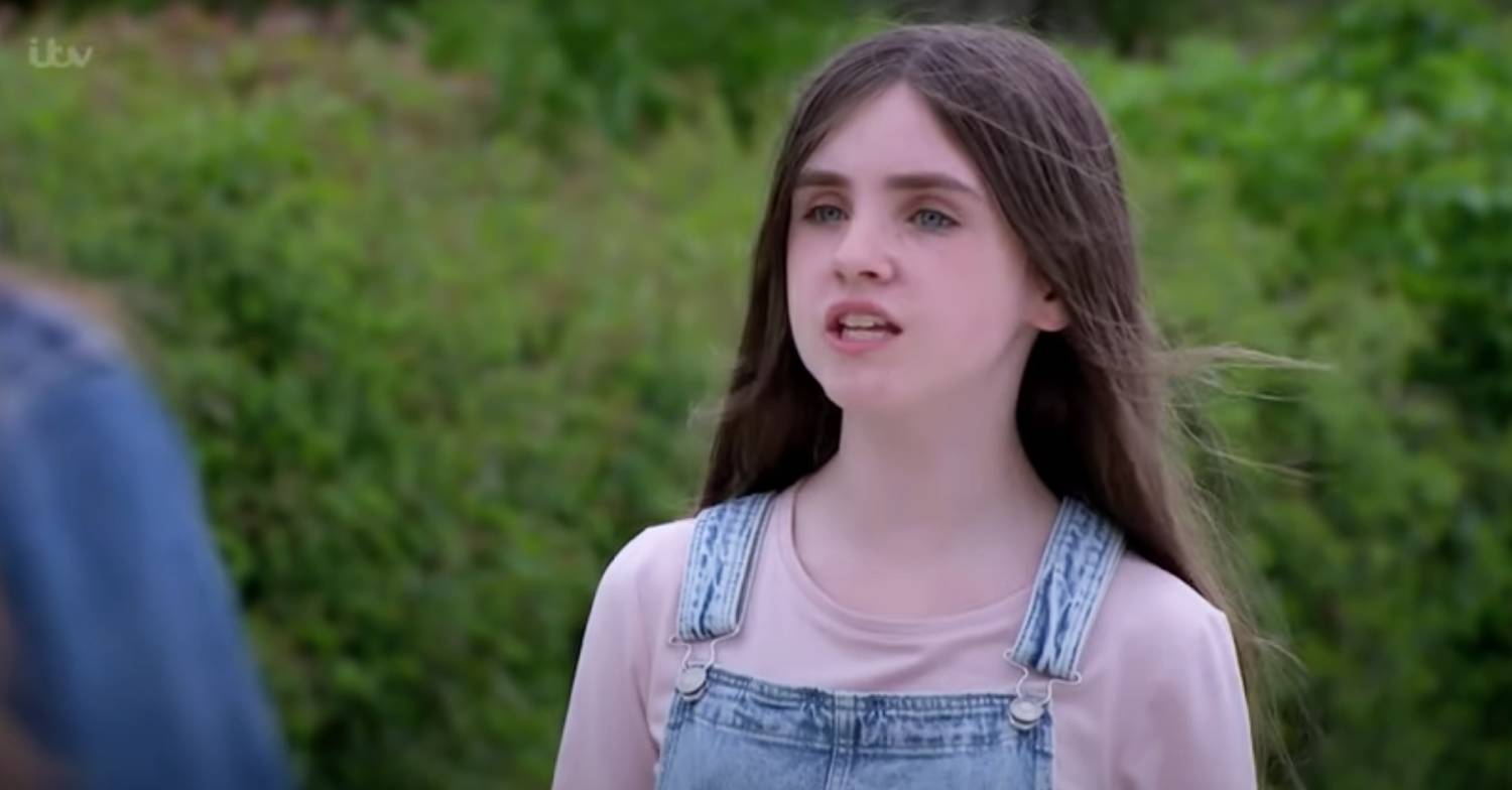 Emmerdale actress Amelia Flanagan in character for a scene as April Dingle