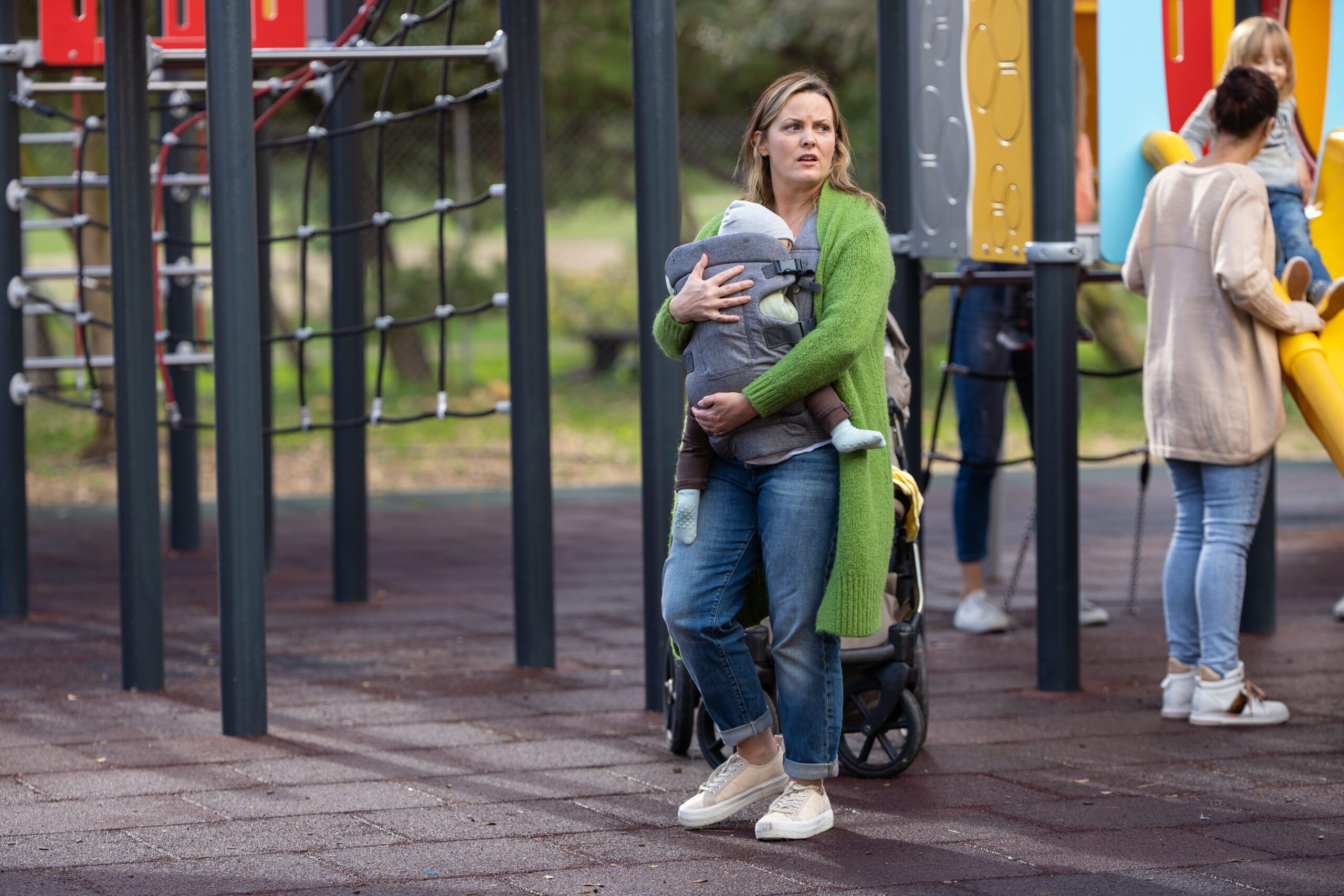 Laura looks around the park in For Her Sins