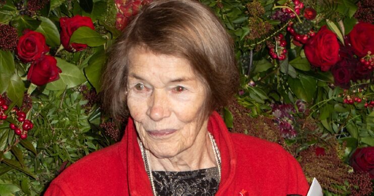 Glenda Jackson attending event in red coat