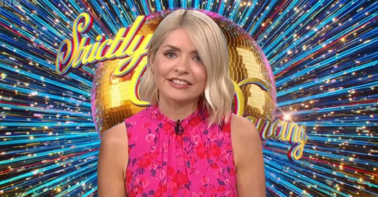 Holly Willoughby in front of Strictly Come Dancing logo