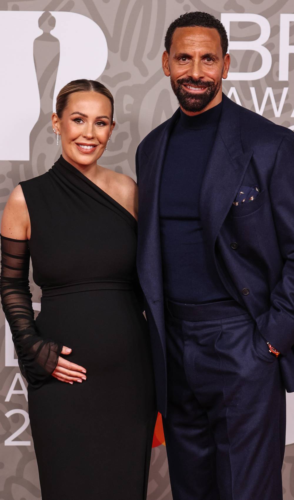Pregnant Kate Ferdinand and husband Rio Ferdinand pose for photos