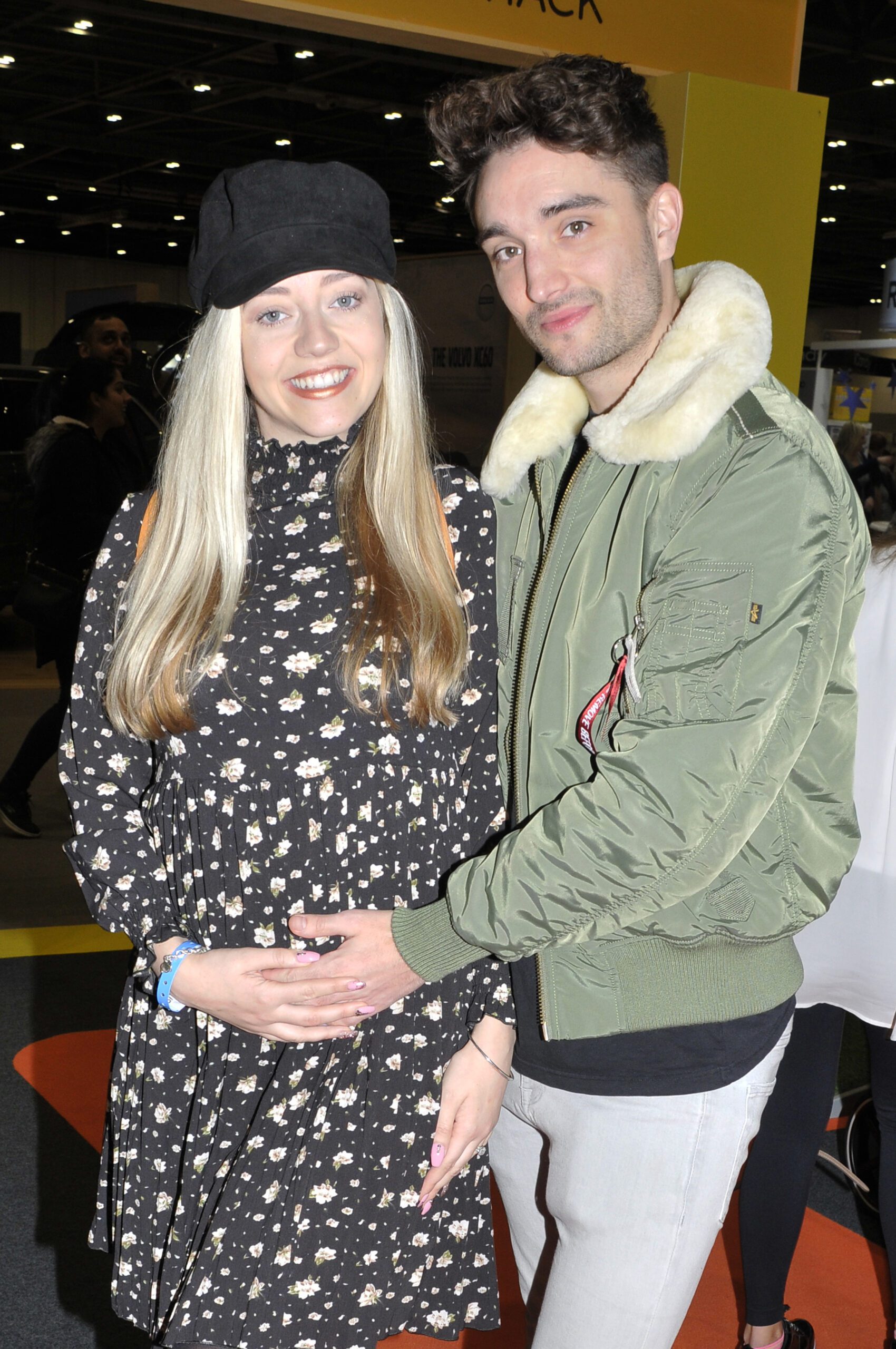 Kelsey and Tom Parker smile together in 2019