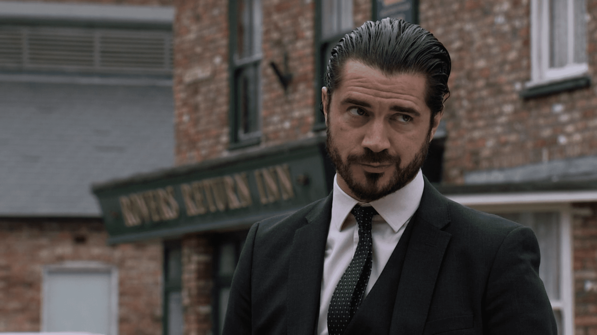 Adam Barlow smiles in Coronation Street