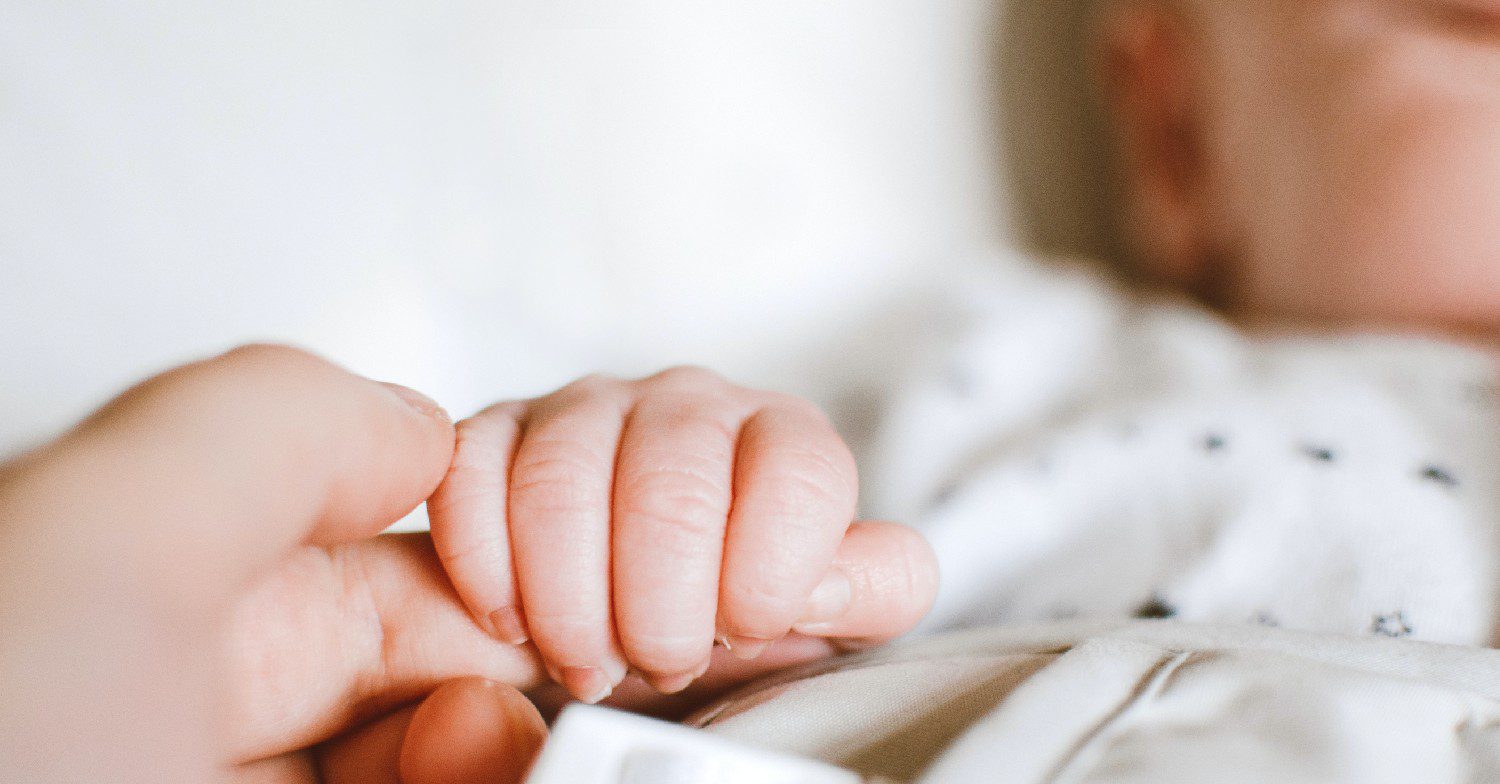 Baby holding hand