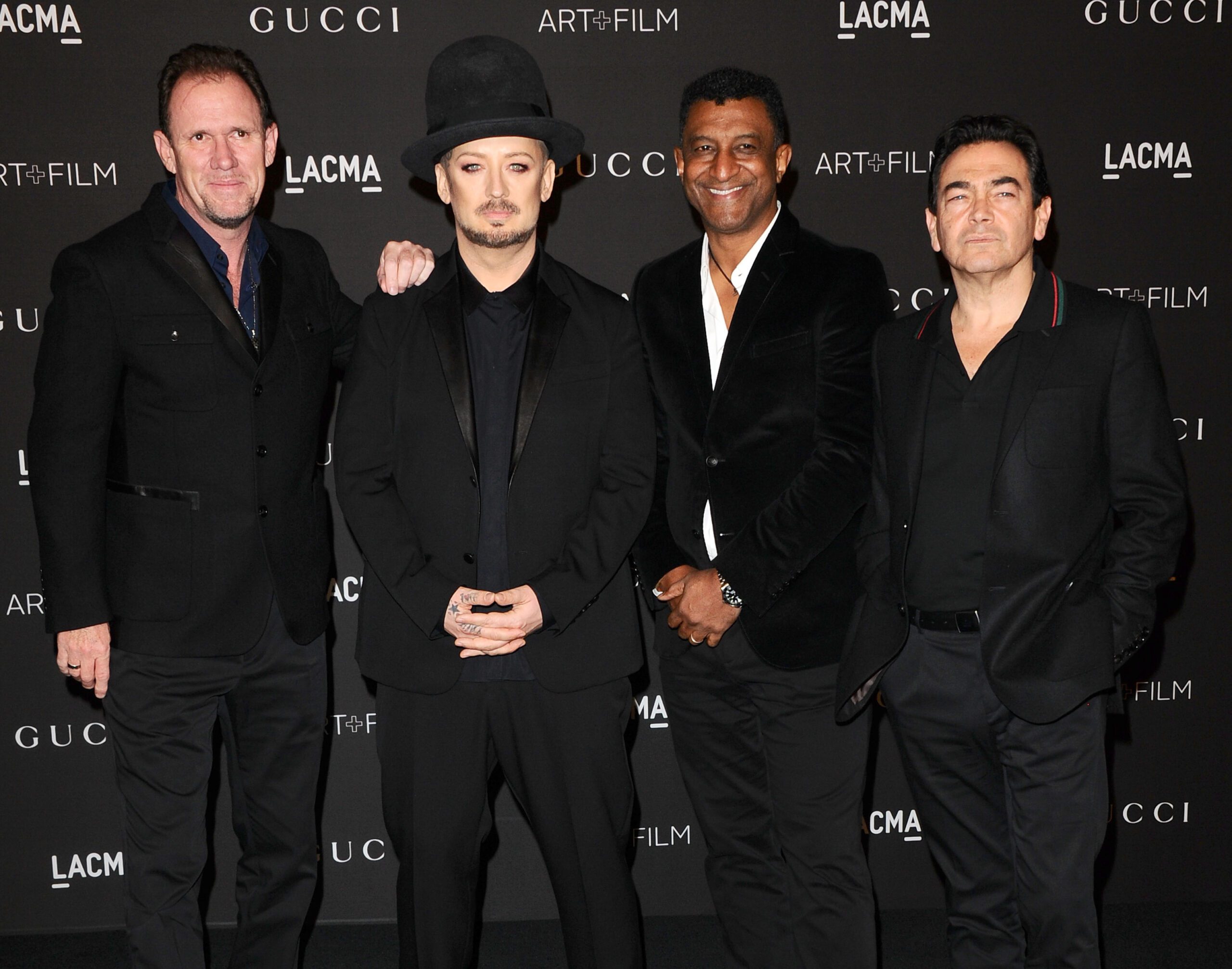 Boy George smiles with Culture Club bandmates