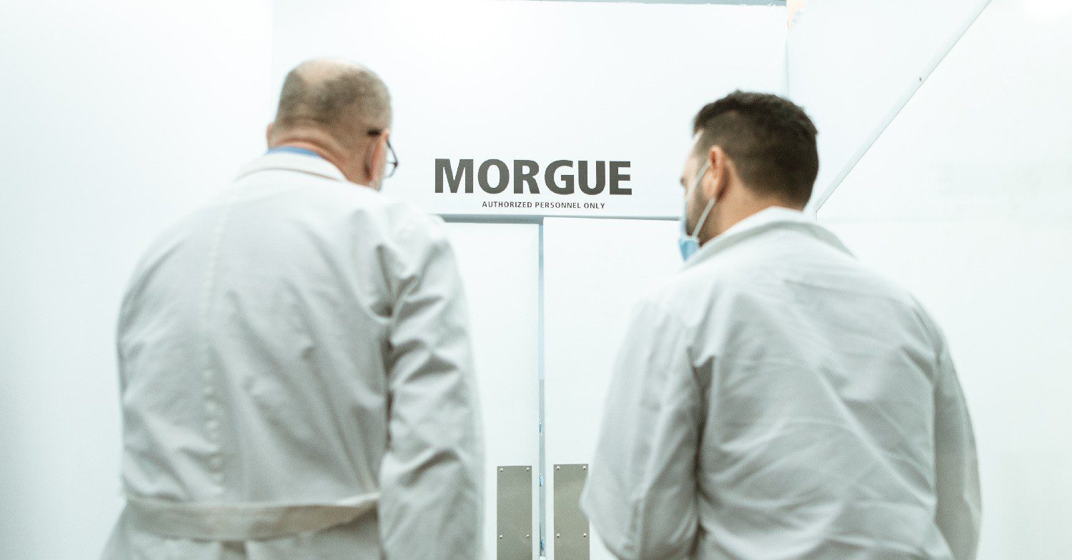 Men walking into a morgue