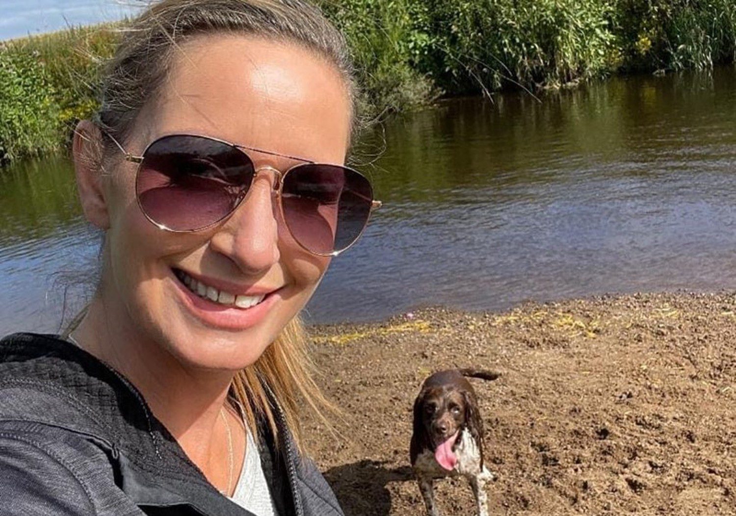 Nicola smiles with dog Willow