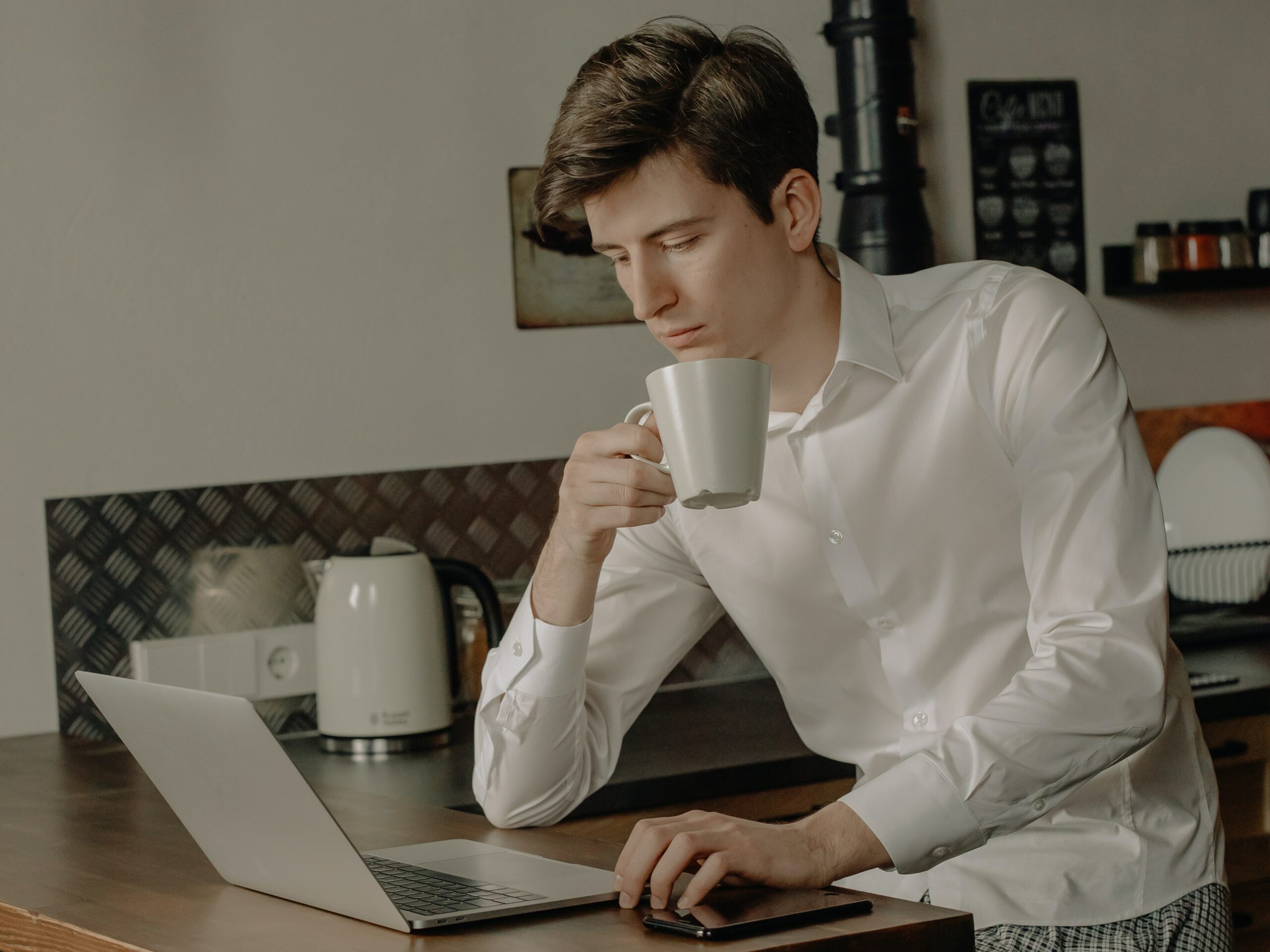 Man looks confused at laptop