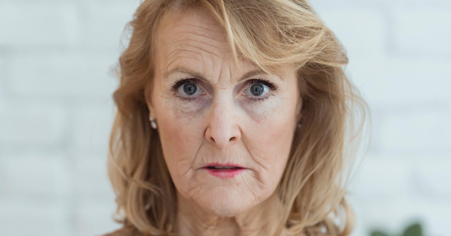 Angry woman frowns