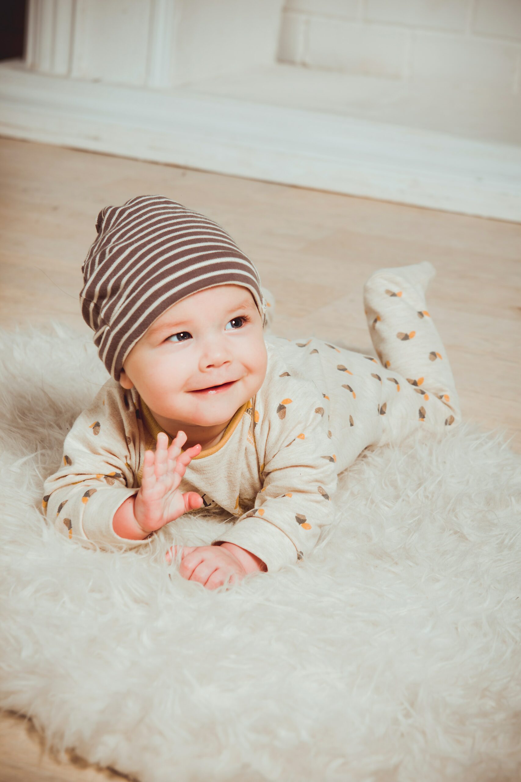 A cute baby smiling and waving