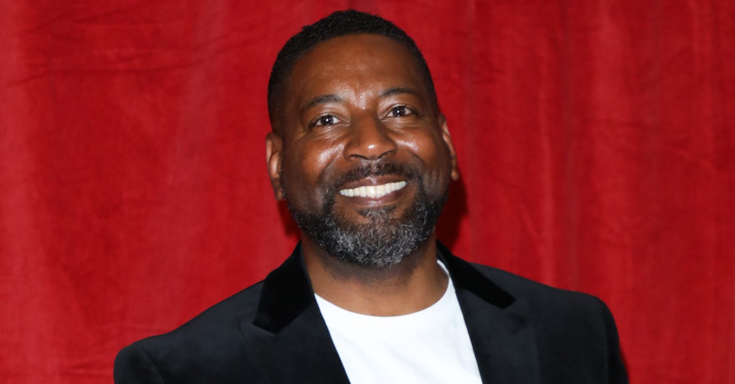 Emmerdale's Kevin Mathurin is smiling on the red carpet